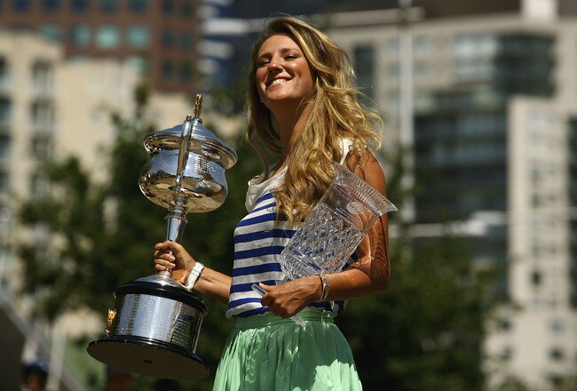 MELBOURNE, AUSTRALIA - JANUARY 29:  Victoria Azarenka of Belarus poses with the Daphne Akhurst Trophy and the World number One Trophy after winning the 2012 Women's Australian Open final, along the Yarra River on January 29, 2012 in Melbourne, Australia.  (Photo by Robert Prezioso/Getty Images)