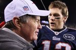 FOXBORO, MA - JANUARY 22:   Tom Brady #12 of the New England Patriots celebrates with head coach Bill Belichick of the New England Patriots after defeating the Baltimore Ravens in the AFC Championship Game at Gillette Stadium on January 22, 2012 in Foxboro, Massachusetts. The New England Patriots defeated the Baltimore Ravens 20-23.  (Photo by Elsa/Getty Images)