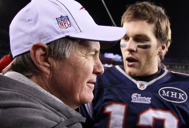 FOXBORO, MA - JANUARY 22:   Tom Brady #12 of the New England Patriots celebrates with head coach Bill Belichick of the New England Patriots after defeating the Baltimore Ravens in the AFC Championship Game at Gillette Stadium on January 22, 2012 in Foxboro, Massachusetts. The New England Patriots defeated the Baltimore Ravens 20-23.  (Photo by Elsa/Getty Images)