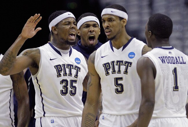 WASHINGTON - MARCH 19:  Nasir Robinson #35 of the Pittsburgh Panthers celebrates with teammates Gilbert Brown#5 and Travon Woodall #1 during the third round of the 2011 NCAA men's basketball tournament at Verizon Center on March 19, 2011 in Washington, DC.  (Photo by Rob Carr/Getty Images)