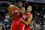 CHARLOTTE, NC - JANUARY 10:  Teammates Kyle Lowry #7 and Kevin Martin #12 of the Houston Rockets against the Charlotte Bobcats during their game at Time Warner Cable Arena on January 10, 2012 in Charlotte, North Carolina.   NOTE TO USER: User expressly acknowledges and agrees that, by downloading and or using this photograph, User is consenting to the terms and conditions of the Getty Images License Agreement.  (Photo by Streeter Lecka/Getty Images)
