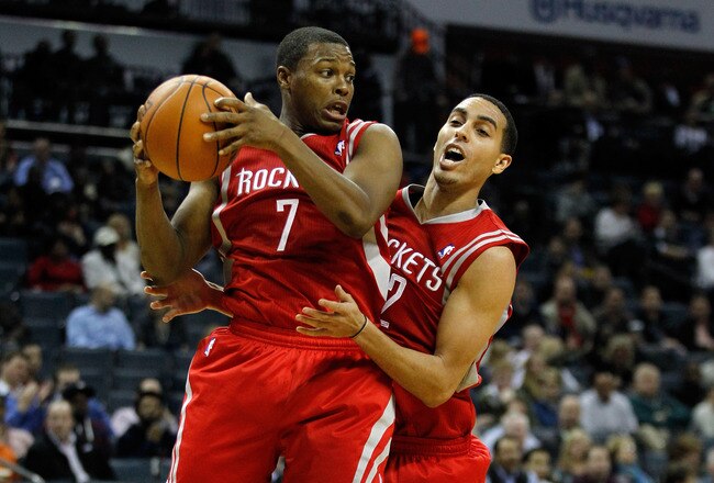 CHARLOTTE, NC - JANUARY 10:  Teammates Kyle Lowry #7 and Kevin Martin #12 of the Houston Rockets against the Charlotte Bobcats during their game at Time Warner Cable Arena on January 10, 2012 in Charlotte, North Carolina.   NOTE TO USER: User expressly acknowledges and agrees that, by downloading and or using this photograph, User is consenting to the terms and conditions of the Getty Images License Agreement.  (Photo by Streeter Lecka/Getty Images)