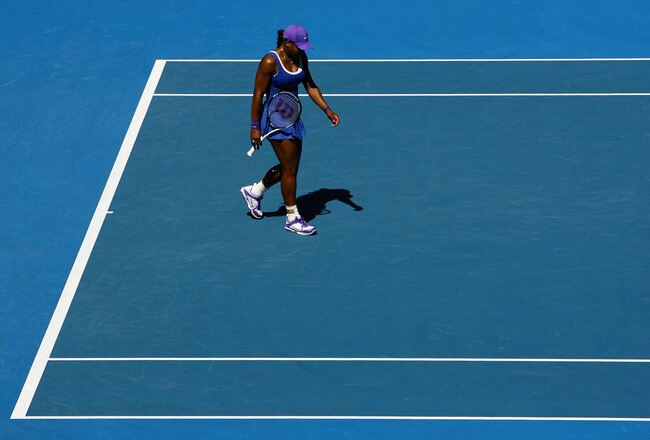 MELBOURNE, AUSTRALIA - JANUARY 23:  Serena Williams of the United States of America reacts after a shot in her fourth round match against Ekaterina Makarova of Russia during day eight of the 2012 Australian Open at Melbourne Park on January 23, 2012 in Melbourne, Australia.  (Photo by Robert Prezioso/Getty Images)