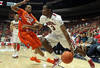 TUCSON, AZ - DECEMBER 10:  Kevin Parrom #3 of the Arizona Wildcats handles the ball under pressure from K.J. McDaniels #32 of the Clemson Tigers during the first half of the college basketball game at McKale Center on December 10, 2011 in Tucson, Arizona. The Wildcats defeated the Tigers 63-47.  (Photo by Christian Petersen/Getty Images)