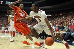 TUCSON, AZ - DECEMBER 10:  Kevin Parrom #3 of the Arizona Wildcats handles the ball under pressure from K.J. McDaniels #32 of the Clemson Tigers during the first half of the college basketball game at McKale Center on December 10, 2011 in Tucson, Arizona. The Wildcats defeated the Tigers 63-47.  (Photo by Christian Petersen/Getty Images)