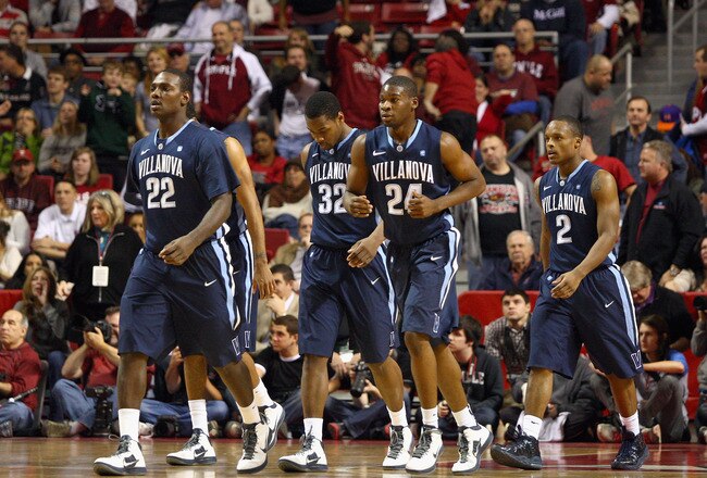 PHILADELPHIA, PA - DECEMBER 10:  (L-R) JayVaughn Pinkston #22. James Bell #32, Achraf Yacoubou #24 and Maalik Wayns #2 of the Villanova Wildcats walk up court against the Temple Owls at the Liacouras Center on December 10, 2011 in Philadelphia, Pennsylvania.  (Photo by Chris Chambers/Getty Images)