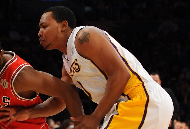 LOS ANGELES, CA - DECEMBER 25:  C.J. Watson #7 of the Chicago Bulls drives against Andrew Goudelock #0 of the Los Angeles Lakers at Staples Center on December 25, 2011 in Los Angeles, California.  NOTE TO USER: User expressly acknowledges and agrees that, by downloading and or using this photograph, User is consenting to the terms and conditions of the Getty Images License Agreement.  (Photo by Lisa Blumenfeld/Getty Images)