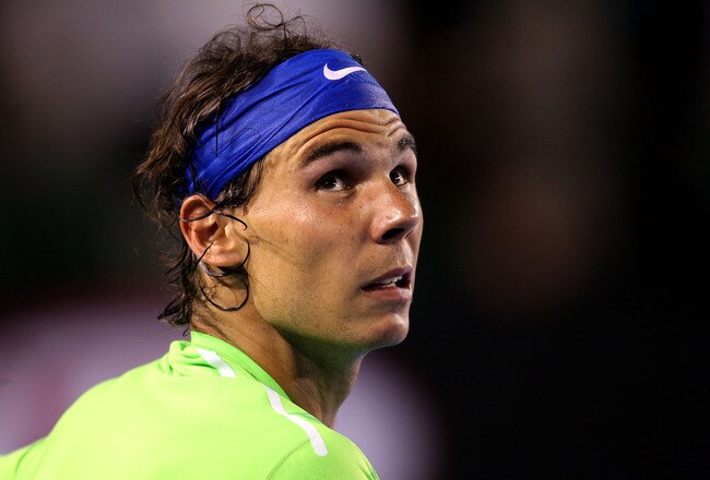 MELBOURNE, AUSTRALIA - JANUARY 29:  Rafael Nadal of Spain looks on between games in his men's final match against Novak Djokovic of Serbia during day fourteen of the 2012 Australian Open at Melbourne Park on January 29, 2012 in Melbourne, Australia.  (Photo by Scott Barbour/Getty Images)