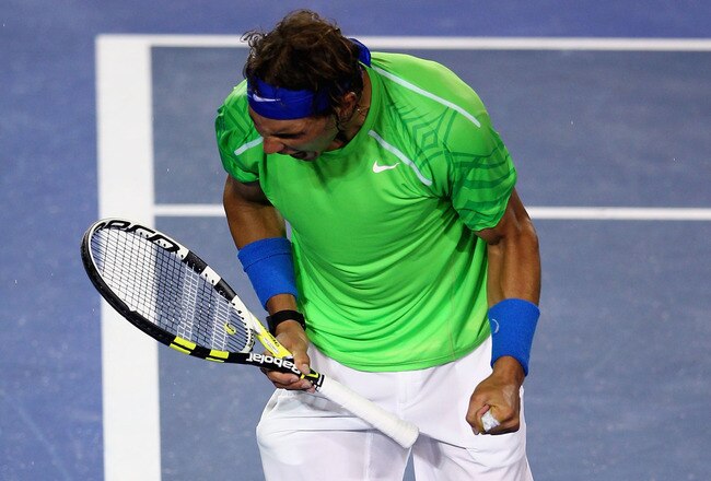 MELBOURNE, AUSTRALIA - JANUARY 29:  Rafael Nadal of Spain celebrates winning a game in his men's final match against Novak Djokovic of Serbia during day fourteen of the 2012 Australian Open at Melbourne Park on January 29, 2012 in Melbourne, Australia.  (Photo by Clive Brunskill/Getty Images)