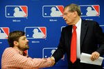 NEW YORK, NY - NOVEMBER 22:  Major League Baseball Commissioner Bud Selig (R) shakes hands with Andrew Miller before a news conference at MLB headquarters on November 22, 2011 in New York City. Selig and Weiner announced a new five-year labor agreement between Major League Baseball and the Major League Baseball Players Association.  (Photo by Patrick McDermott/Getty Images)