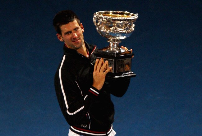 MELBOURNE, AUSTRALIA - JANUARY 29:  Novak Djokovic of Serbia poses with the Norman Brookes Challenge Cup after winning the men's final match against Rafael Nadal of Spain during day fourteen of the 2012 Australian Open at Melbourne Park on January 29, 2012 in Melbourne, Australia.  (Photo by Mark Dadswell/Getty Images)
