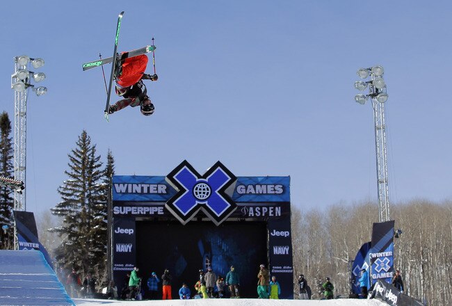 ASPEN, CO - JANUARY 28:  Tucker Perkins spins above the pipe during warm up for the finals of the men's ski superpipe during Winter X Games 2012 at Buttermilk Mountain on January 28, 2012 in Aspen, Colorado. Perkins finished fifth.  (Photo by Doug Pensinger/Getty Images)