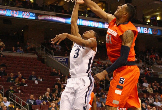 PHILADELPHIA, PA - JANUARY 11:  Tyrone Johnson #3 of the Villanova Wildcats drives for a shot attempt against Fab Melo #51 of the Syracuse Orange at the Wells Fargo Center on January 11, 2012 in Philadelphia, Pennsylvania.  (Photo by Chris Chambers/Getty Images)