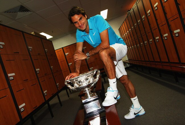 MELBOURNE, AUSTRALIA - JANUARY 31:  Roger Federer of Switzerland poses with the Norman Brookes Challenge Cup in the players locker room after winning the men's final match against Andy Murray of Great Britain during day fourteen of the 2010 Australian Open at Melbourne Park on January 31, 2010 in Melbourne, Australia.  (Photo by Clive Brunskill/Getty Images)
