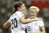 VANCOUVER, CANADA - JANUARY 22:  Abby Wambach #20 and Mega Rapinoe #15 of the United States celebrate a goal against Guatemala during the 2012 CONCACAF Women's Olympic Qualifying Tournament at BC Place on January 22, 2012 in Vancouver, British Columbia, Canada.  (Photo by Jeff Vinnick/Getty Images)