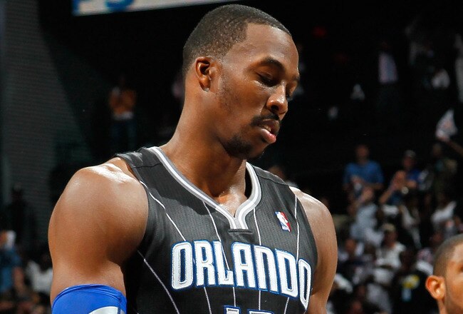 ATLANTA, GA - APRIL 28:  Dwight Howard #12 of the Orlando Magic reacts after a turnover to the Atlanta Hawks during Game Six of the Eastern Conference Quarterfinals in the 2011 NBA Playoffs at Philips Arena on April 28, 2011 in Atlanta, Georgia.  NOTE TO USER: User expressly acknowledges and agrees that, by downloading and or using this photograph, User is consenting to the terms and conditions of the Getty Images License Agreement.  (Photo by Kevin C. Cox/Getty Images)
