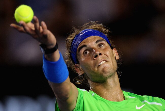 MELBOURNE, AUSTRALIA - JANUARY 29:  Rafael Nadal of Spain serves in his men's final match against Novak Djokovic of Serbia during day fourteen of the 2012 Australian Open at Melbourne Park on January 29, 2012 in Melbourne, Australia.  (Photo by Scott Barbour/Getty Images)