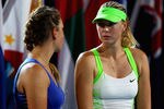 MELBOURNE, AUSTRALIA - JANUARY 28:  Maria Sharapova of Russia (R) speaks to Victoria Azarenka of Belarus (L) after losing her women's final match against  during day thirteen of the 2012 Australian Open at Melbourne Park on January 28, 2012 in Melbourne, Australia.  (Photo by Mark Kolbe/Getty Images)