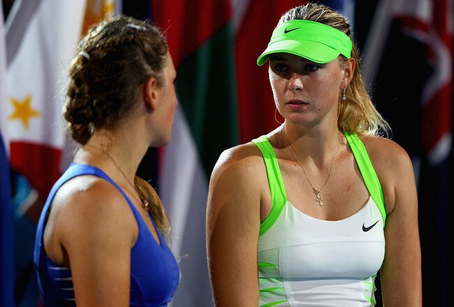 MELBOURNE, AUSTRALIA - JANUARY 28:  Maria Sharapova of Russia (R) speaks to Victoria Azarenka of Belarus (L) after losing her women's final match against  during day thirteen of the 2012 Australian Open at Melbourne Park on January 28, 2012 in Melbourne, Australia.  (Photo by Mark Kolbe/Getty Images)