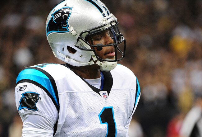 NEW ORLEANS, LA - JANUARY 1: Cam Newton #1 of the Carolina Panthers heads off the field after throwing an interception against the New Orleans Saints at the Mercedes-Benz Superdome on January 1, 2012 in New Orleans, Louisiana  (Photo by Scott Cunningham/Getty Images)