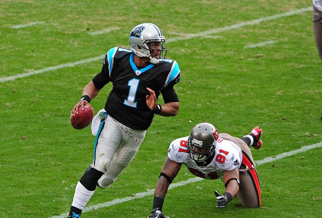 CHARLOTTE, NC - DECEMBER 24: Cam Newton #1 of the Carolina Panthers scrambles against the Tampa Bay Buccaneers at Bank of America Stadium on December 24, 2011 in Charlotte, North Carolina  (Photo by Scott Cunningham/Getty Images)