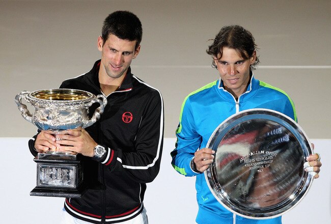 MELBOURNE, AUSTRALIA - JANUARY 29:  Novak Djokovic of Serbia (L) poses with the Norman Brookes Challenge Cup alongside Raphael Nadal of Spain with the runners-up trophy after winning the men's final match against Rafael Nadal of Spain during day fourteen of the 2012 Australian Open at Melbourne Park on January 29, 2012 in Melbourne, Australia.  (Photo by Lucas Dawson/Getty Images)