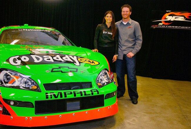 MOORESVILLE, NC - DECEMBER 17:  Danica Patrick (L), driver of the #7 GoDaddy.com Chevrolet poses with team owner Dale Earnhardt Jr. (R), at JR Motorsports on December 17, 2009 in Mooresville, North Carolina.  (Photo by Jason Smith/Getty Images)