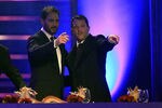 LAS VEGAS, NV - DECEMBER 02:  (L-R) Jimmie Johnson and Tony Stewart point towards the audience as Stewart is introduced during the NASCAR Sprint Cup Series Champion's Week Awards Ceremony at Wynn Las Vegas on December 2, 2011 in Las Vegas, Nevada.  (Photo by Chris Trotman/Getty Images for NASCAR)