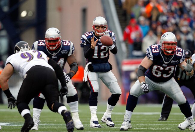 FOXBORO, MA - JANUARY 22:  Tom Brady #12 of the New England Patriots hikes the ball against the Baltimore Ravens during their AFC Championship Game at Gillette Stadium on January 22, 2012 in Foxboro, Massachusetts.  (Photo by Rob Carr/Getty Images)