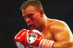TAMPA, FL - OCTOBER 1:  Bleeding badly from a cut under his left eye, Vinny Maddalone takes on Brian Minto in a Heavyweight bout at the St. Pete Times Forum on October 1, 2005 in Tampa, Florida.  (Photo by Doug Benc/Getty Images)