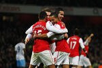LONDON, ENGLAND - JANUARY 29:  Theo Walcott of Arsenal (14) celebrates with team mates as he scores their second gaol during the FA Cup with Budweiser Fourth Round match between Arsenal and Aston Villa at Emirates Stadium on January 29, 2012 in London, England.  (Photo by Paul Gilham/Getty Images)
