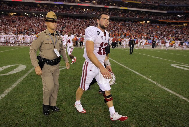 GLENDALE, AZ - JANUARY 02:  Andrew Luck #12 of the Stanford Cardinal walks off of the field after Stanford lost 41-38 in overtime against the Oklahoma State Cowboys during the Tostitos Fiesta Bowl on January 2, 2012 at University of Phoenix Stadium in Glendale, Arizona.  (Photo by Doug Pensinger/Getty Images)