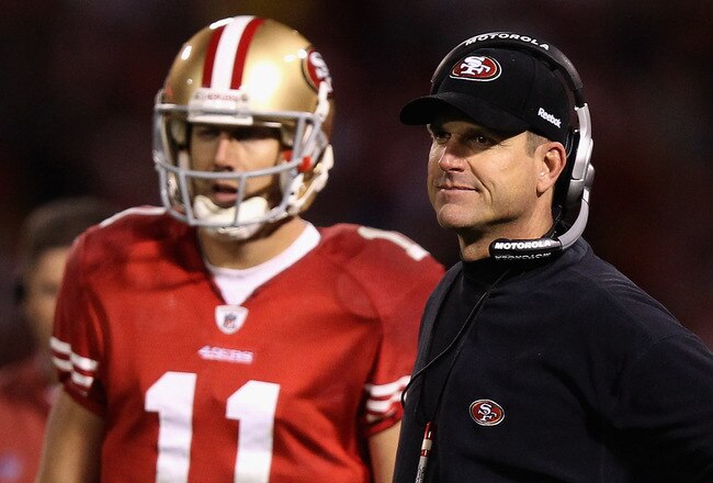 SAN FRANCISCO, CA - JANUARY 22:  Alex Smith #11 of the San Francisco 49ers stands with head coach Jim Harbaugh of the San Francisco 49ers
during the fourth quarter of the NFC Championship Game against the New York Giants at Candlestick Park on January 22, 2012 in San Francisco, California.  (Photo by Ezra Shaw/Getty Images)