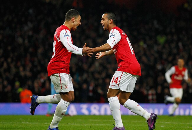 LONDON, ENGLAND - JANUARY 29:  Theo Walcott of Arsenal (14) celebrates with team mate Alex Oxlade-Chamberlain as he scores their second gaol during the FA Cup with Budweiser Fourth Round match between Arsenal and Aston Villa at Emirates Stadium on January 29, 2012 in London, England.  (Photo by Paul Gilham/Getty Images)