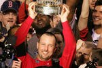 ST LOUIS - OCTOBER 27:  Tim Wakefield #49 of the Boston Red Sox celebrates with the trophy after defeating the St. Louis Cardinals 3-0 in game four of the World Series on October 27, 2004 at Busch Stadium in St. Louis, Missouri. (Photo by Al Bello/Getty Images)