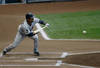 MILWAUKEE, WI - JUNE 24: Alexi Casilla #12 of the Minnesota Twins bunts against the Milwaukee Brewers at Miller Park on June 24, 2011 in Milwaukee, Wisconsin. (Photo by Scott Boehm/Getty Images)