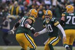 GREEN BAY, WI - JANUARY 01:  Matt Flynn #10 of the Green Bay Packers celebrates a touchdown pass with Josh Sitton #71 against the Detroit Lions at Lambeau Field on January 1, 2012 in Green Bay, Wisconsin. The Packers defeated the Lions 45-41.  (Photo by Jonathan Daniel/Getty Images)