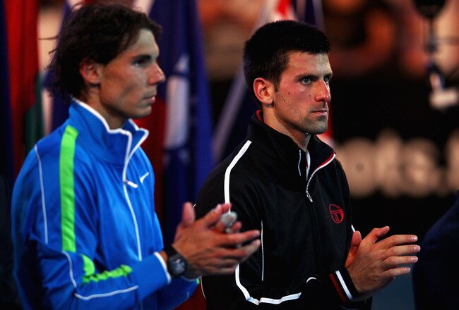 MELBOURNE, AUSTRALIA - JANUARY 29:  Rafael Nadal of Spain and Novak Djokovic of Serbia applaud during the presentation ceremony after Djokovic won the men's final match against  during day fourteen of the 2012 Australian Open at Melbourne Park on January 29, 2012 in Melbourne, Australia.  (Photo by Clive Brunskill/Getty Images)