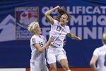 VANCOUVER, CANADA - JANUARY 29:  Alex Morgan #13 of the United States celebrates with Mega Rapinoe #15 after scoring against Canada during the first half of championship action of the 2012 CONCACAF Women's Olympic Qualifying Tournament at BC Place on January 29, 2012 in Vancouver, British Columbia, Canada.  (Photo by Rich Lam/Getty Images)