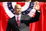 ANAHEIM, CA - DECEMBER 10:  Albert Pujols waves as he takes the stage at a public press conference introducing newly signed Los Angeles Angels of Anaheim  players Albert Pujols and C.J. Wilson at Angel Stadium on December 10, 2011 in Anaheim, California.  (Photo by Stephen Dunn/Getty Images)