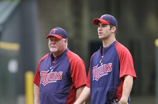 CHICAGO, IL - AUGUST 30:  Manager Ron Gardenhire #35 of the Minnesota Twins and Joe Mauer #7 talk during infield practice before the game against the Chicago White Sox on August 30, 2011 at U.S. Cellular Field in Chicago, Illinois.  (Photo by David Banks/Getty Images)