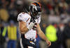 FOXBORO, MA - JANUARY 14:  Tim Tebow #15 of the Denver Broncos walks back to the bench after he was sacked in the second half by the New England Patriots defense during their AFC Divisional Playoff Game at Gillette Stadium on January 14, 2012 in Foxboro, Massachusetts.  (Photo by Jim Rogash/Getty Images)