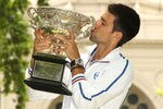 MELBOURNE, AUSTRALIA - JANUARY 30:  Novak Djokovic of Serbia poses with the Norman Brookes Challenge Cup after winning the 2012 men's Australian Open, at Carlton Gardens on January 30, 2012 in Melbourne, Australia.  (Photo by Lucas Dawson/Getty Images)