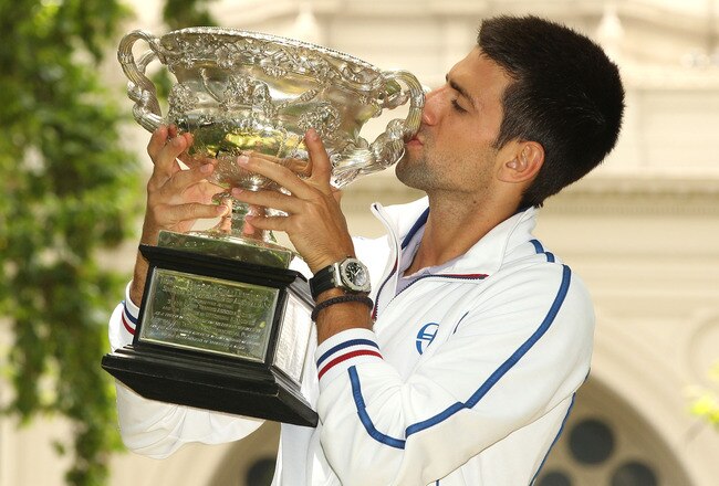 MELBOURNE, AUSTRALIA - JANUARY 30:  Novak Djokovic of Serbia poses with the Norman Brookes Challenge Cup after winning the 2012 men's Australian Open, at Carlton Gardens on January 30, 2012 in Melbourne, Australia.  (Photo by Lucas Dawson/Getty Images)