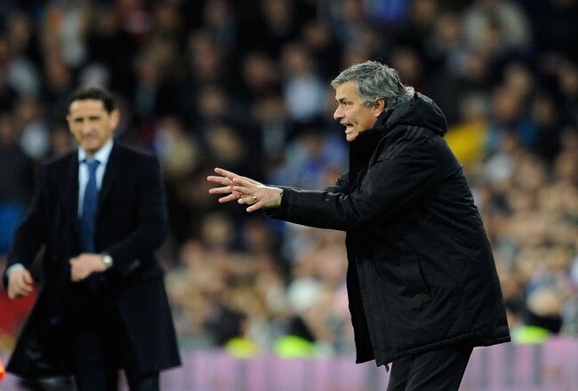 MADRID, SPAIN - JANUARY 28:  Real Madrid head coach Jose Mourinho (R) manages his side near Real Zaragoza head coach Manuel Jiminez during the La Liga match between Real Madrid and Real Zaragoza at Estadio Santiago Bernabeu on January 28, 2012 in Madrid, Spain.  (Photo by Denis Doyle/Getty Images)