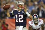GLENDALE, AZ - FEBRUARY 03:  Quarterback Tom Brady #12 of the New England Patriots drops back to pass against the New York Giants the second half of Super Bowl XLII on February 3, 2008 at the University of Phoenix Stadium in Glendale, Arizona. The Giants defeated the Patriots 17-14.  (Photo by Donald Miralle/Getty Images)