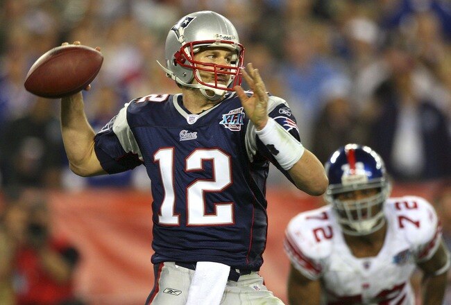 GLENDALE, AZ - FEBRUARY 03:  Quarterback Tom Brady #12 of the New England Patriots drops back to pass against the New York Giants the second half of Super Bowl XLII on February 3, 2008 at the University of Phoenix Stadium in Glendale, Arizona. The Giants defeated the Patriots 17-14.  (Photo by Donald Miralle/Getty Images)