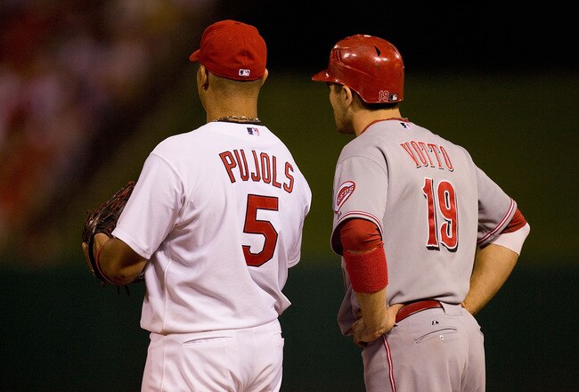 ST. LOUIS - SEPTEMBER 3: Albert Pujols #5 of the St. Louis Cardinals and Joey Votto #19 of the Cincinnati Reds stand on first base at Busch Stadium on September 3, 2010 in St. Louis, Missouri.  The Cardinals beat the Reds 3-2.  (Photo by Dilip Vishwanat/Getty Images)