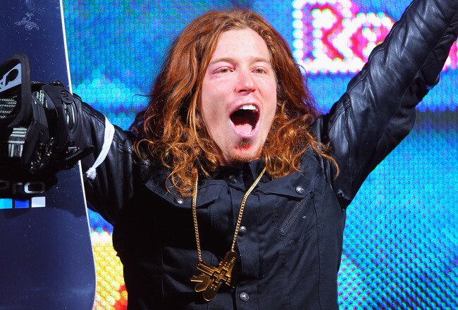 ASPEN, CO - JANUARY 29:  Shaun White celebrates as he takes the podium for the goal medal in the men's snowboard superpipe final during Winter X Games 2012 at Buttermilk Mountain on January 29, 2012 in Aspen, Colorado. White earned his fifth consecutive gold medal in the event and scored a perfect 100 points on his final run.  (Photo by Doug Pensinger/Getty Images)