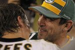 GREEN BAY, WI - SEPTEMBER 08: Aaron Rodgers #12 of the Green Bay Packers talks with Drew Brees #9 of the New Orleans Saints after the NFL opening season game at Lambeau Field on September 8, 2011 in Green Bay, Wisconsin. The Packers defeated the Saints 42-34. (Photo by Jonathan Daniel/Getty Images)